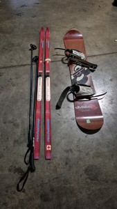 snowboard and skis