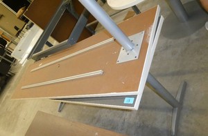 Two tables 84x24, one is missing a leg, grey surface