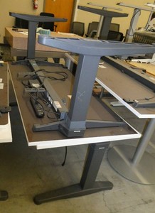 Two Steelcase electric adjustable height tablesdesks