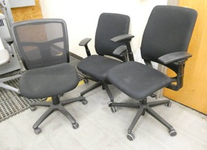 3 black chairs of various type