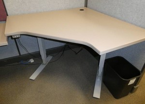 Adjustable height corner desk 48 inches each corner side against the wall
