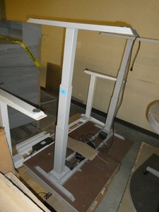 Two Electric adjustable height 48x30 and 60x30 desks tables