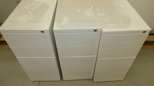 Three white metal file cabinets 11 wide 19 deep 23 high