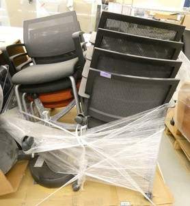 8 stacking chairs on wheels, 6 grey and 2 orange