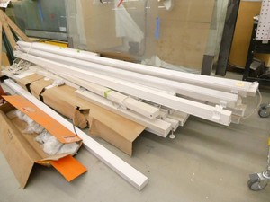 Pallet of led light fixtures 2-12 inches wide most are 12 ft long, approx 20