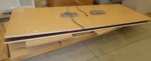 Two powered table tops with wood panel legs