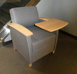 Chair with writing surface