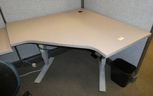 Adjustable height corner desk 48 inches each corner side against the wall