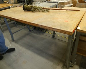 72x36 Workbench with wood top and steel legs, and a roll of speaker wire