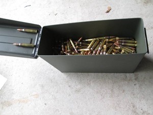 Metal ammo box containing a large q...