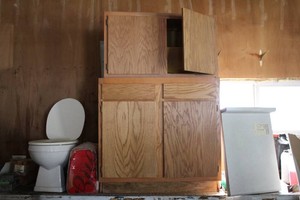 Bathroom set up toilet, cabinets, a...