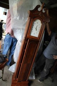 Classy clock in a tower with cupboa...