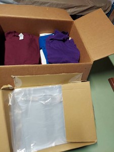 Lot Including Approximately Blank T-Shirts & Uline Poly Bags