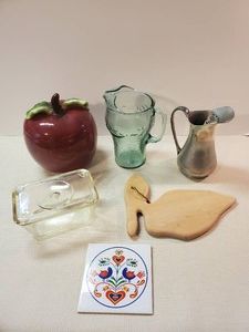 Various Kitchen items Pelican shaped wood Cutting Board, Coca cola drink pitcher, Apple Cookie jar and more