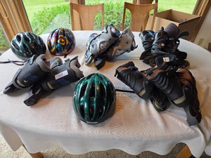 3 Pairs of Roller Blades & Helmets