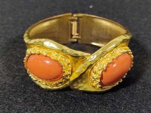Gold Tone Hinged Coral Colored Statement Bracelet