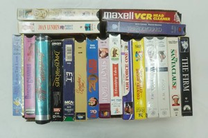 VCR tapes including The Firm, Air Force One, Hope Floats and others