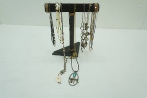variety of necklaces on stand