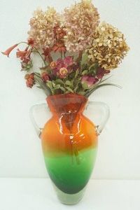 vintage multi  colored glass case with dry floral arrangement 13  tall (handle is broken)