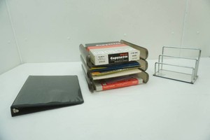 office supplies including labels, carbon paper, file racks