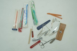 personal hygiene items including nail clipper, NIP tooth brushes, files, scissors