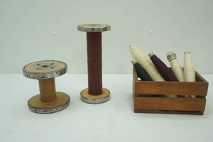 vintage thread spools and wood basket