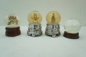 4 snow globes 2 animated and 1 musical