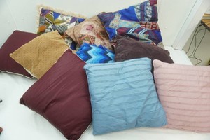 large assortment of throw pillows