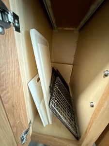 Lot of Assorted Plastic White Cutting Boards and Wire Cooling Racks