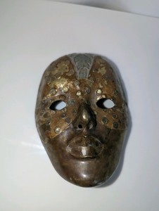 Vintage brass wall mask