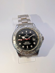 Luxury Designer Replica- untested, in rough shape, band has wear (see pictures)