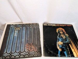 1970 vinyl LP titled Tap Root Manuscript by Neil Diamond and 1972 double LP vinyl album Hot August Night by Neil Diamond