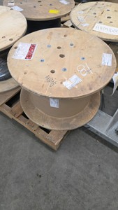 large wooden spool of wire. 203