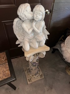 statue on Roman style pillar