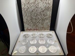 Twelve Beautiful Uncirculated New Orleans Mint Silver Morgan Dollars in a Capital Case- 1884-O (3) 1885-O (2) 1901-O (2) 1902-O (3) 1904-O (2)