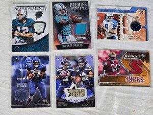 Lot of 6 Relic Football Cards Featuring Russell Wilson, Frank Gore, Shaun Alexander, Steve McNair, DeVante Parker, and Bob Griese. Includes Rookie Cards, Jerseys, Autos