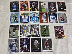 Lot of Football Cards Featuring Cam Ward, Troy Aikman, and Xavier Legette Plus Others. Includes rookies, draft class cards, and special features like Rated Rookie and Men of Mastery.