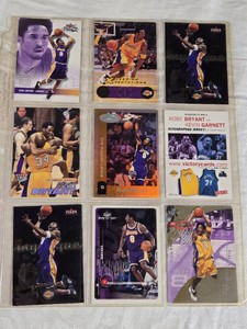 Lot of Kobe Bryant Basketball Cards featuring various brands such as Upper Deck and Fleer, highlighting special features and action shots.
