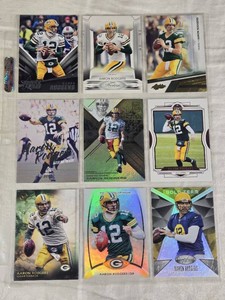 Lot of 9 Aaron Rodgers Football Cards with Various Brands and Holos.