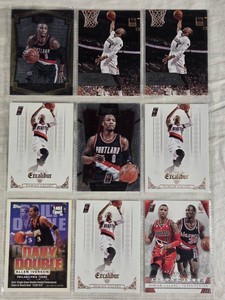 Lot of 9 Damian Lillard Basketball Cards, Including Select and Prestige Sets.
