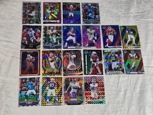 Lot of 20 Football Cards Featuring Players Like Marshawn Lynch, Calvin Johnson, and Aaron Rodgers with Holo Effects and Special Editions