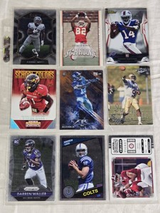 Lot of 9 Football Cards Featuring DAndre Swift, Dwayne Bowe, Sammy Watkins Rookie, Stefon Diggs, Odell Beckham Jr. Rookie, Steve McNair, Darren Waller Rookie, Andrew Luck, and Bryce Young