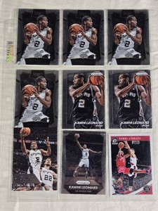 Lot of 9 Kawhi Leonard Basketball Cards, Featuring Panini, Select, and Donruss Series with San Antonio Spurs and Toronto Raptors.