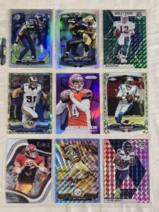 Lot of 9 Football Cards Including Carson Palmer, Chris Long, Earl Thomas, Antonio Brown, Andy Dalton, Marshawn Lynch, Tyler Lockett, Cam Newton, and Dan Marino