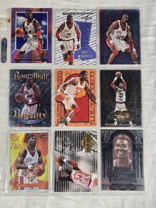 Lot of 9 Hakeem Olajuwon Basketball Cards including Topps Special Features Holo, Hardwood Leader.