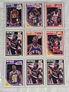 Lot of 9 Basketball Cards featuring Karl Malone, Clyde Drexler, Patrick Ewing, Dennis Rodman, Akeem Olajuwon, Reggie Miller, and Earvin Johnson