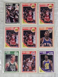 Lot of 9 Basketball Cards Featuring Larry Bird, Hakeem Olajuwon, Karl Malone, Patrick Ewing, Dennis Rodman, and Clyde Drexler