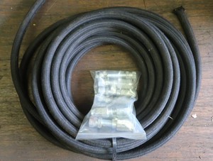 NEW HYDRAULIC HOSE AND BAG OF NEW COUPLINGS