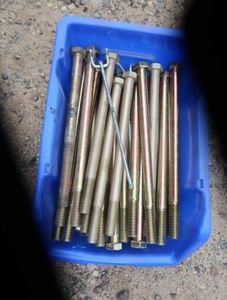BLUE BIN FULL OF NEW LONG BOLTS