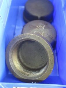 2.5 PIPE CAPS IN BLUE PLASTIC CONTAINER